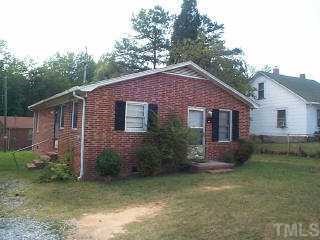 901 South Main Street Roxboro, NC 27573 - Photo 1 of 1 a front view of a house with garden