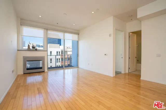 a view of a livingroom with wooden floor