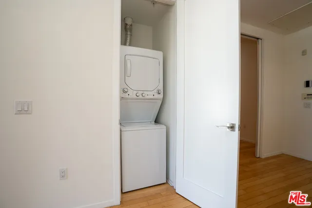 a view of bathroom with a toilet a sink and a mirror