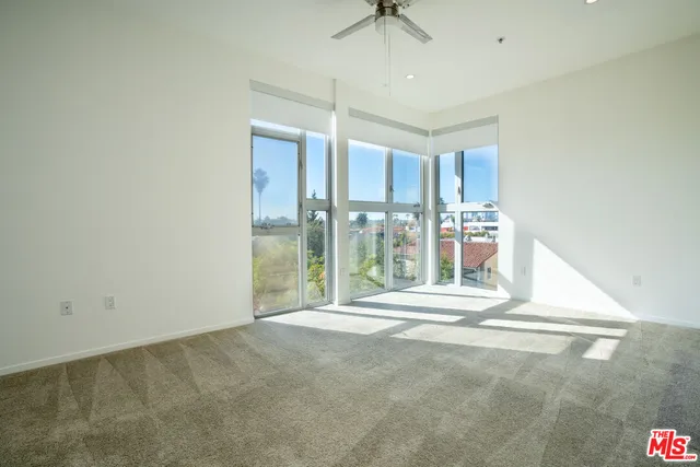 a view of an empty room with a sliding door