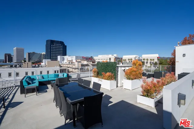 a view of a terrace with furniture and a table