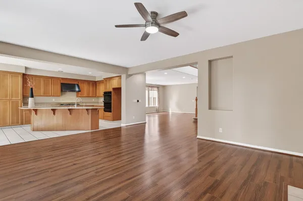 a view of kitchen with cabinets and wooden floor