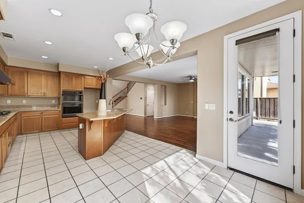 a kitchen with stainless steel appliances a refrigerator and microwave