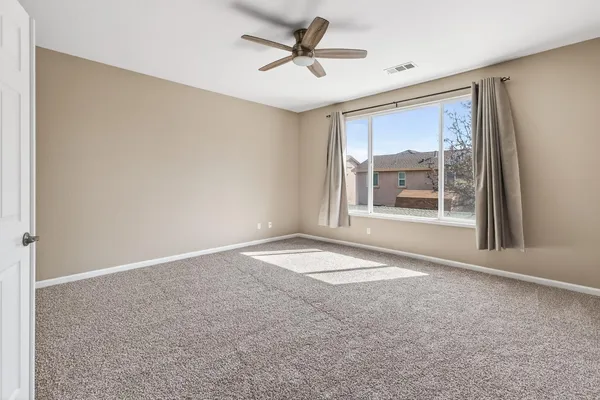 an empty room with a empty space and windows