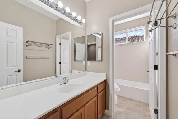 a bathroom with a sink double vanity and a mirror