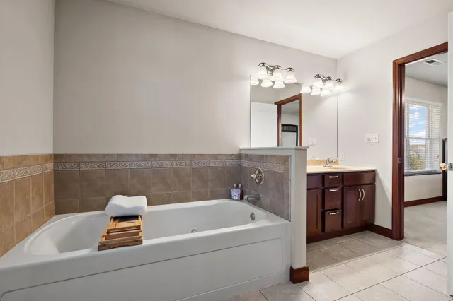 a bath tub sitting in a bathroom and bathtub
