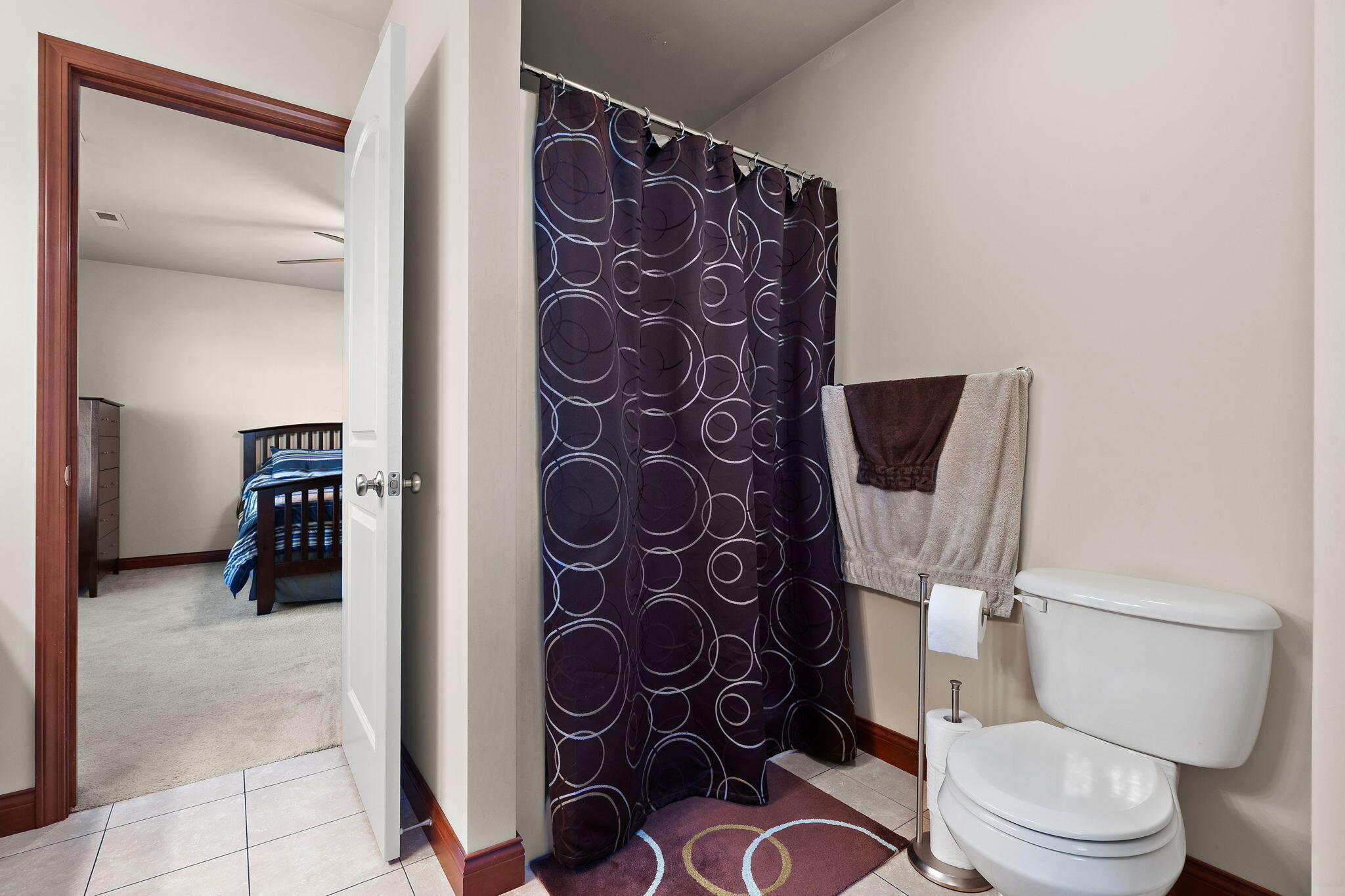 1156 Donegal Lane Crown Point, IN 46307 - Photo 17 of 25 a white toilet sitting next to a bathroom and a shower