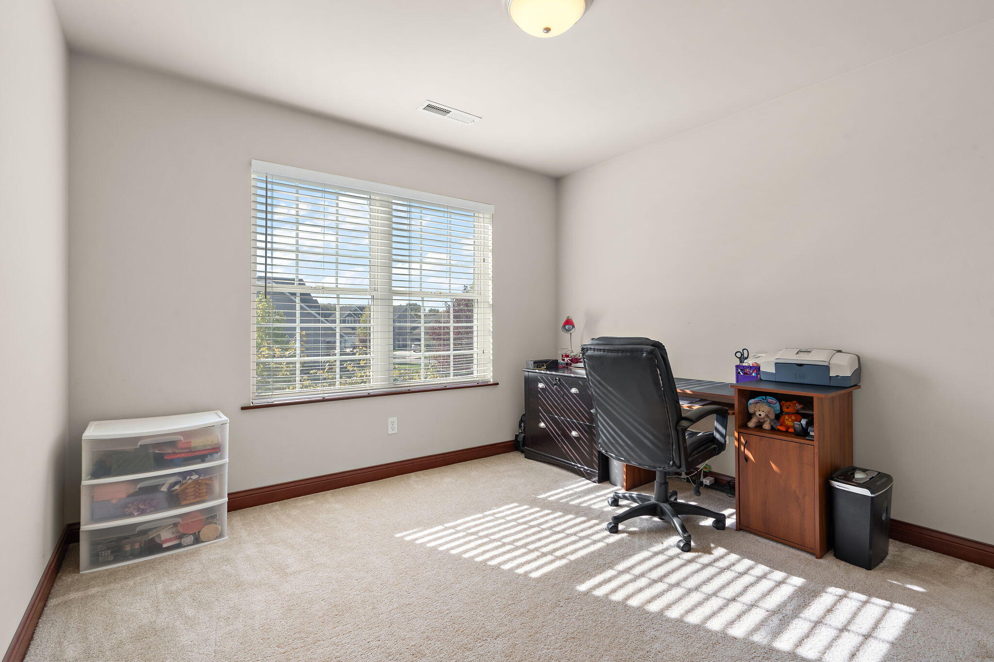 1156 Donegal Lane Crown Point, IN 46307 - Photo 19 of 25 a view of a workspace with furniture and a window