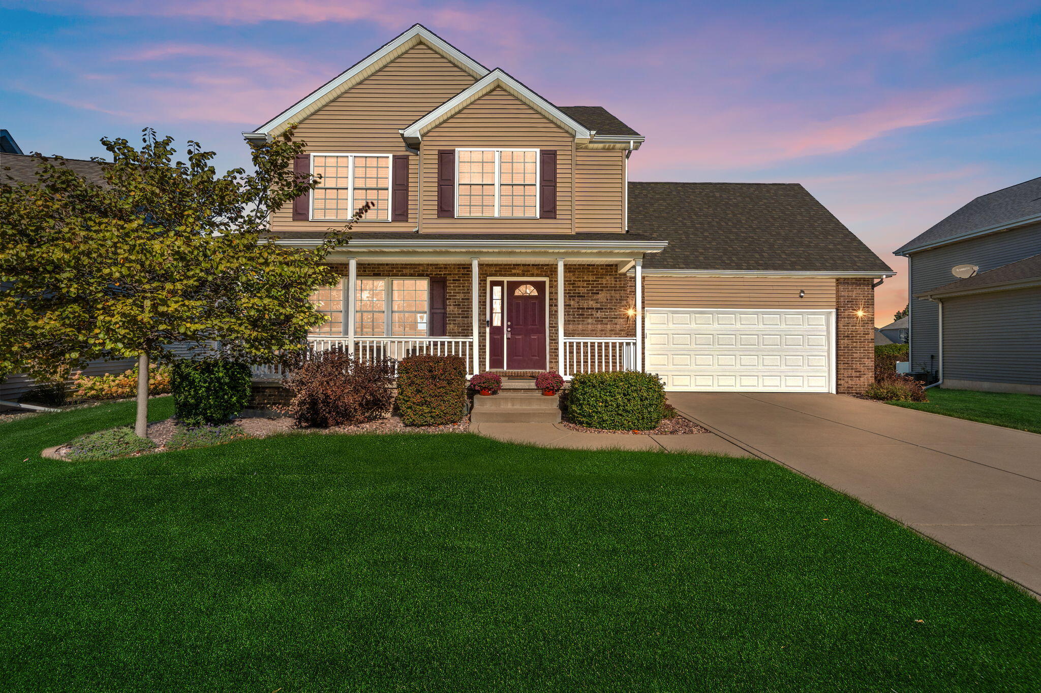1156 Donegal Lane Crown Point, IN 46307 - Photo 2 of 25 a front view of a house with a yard and garage