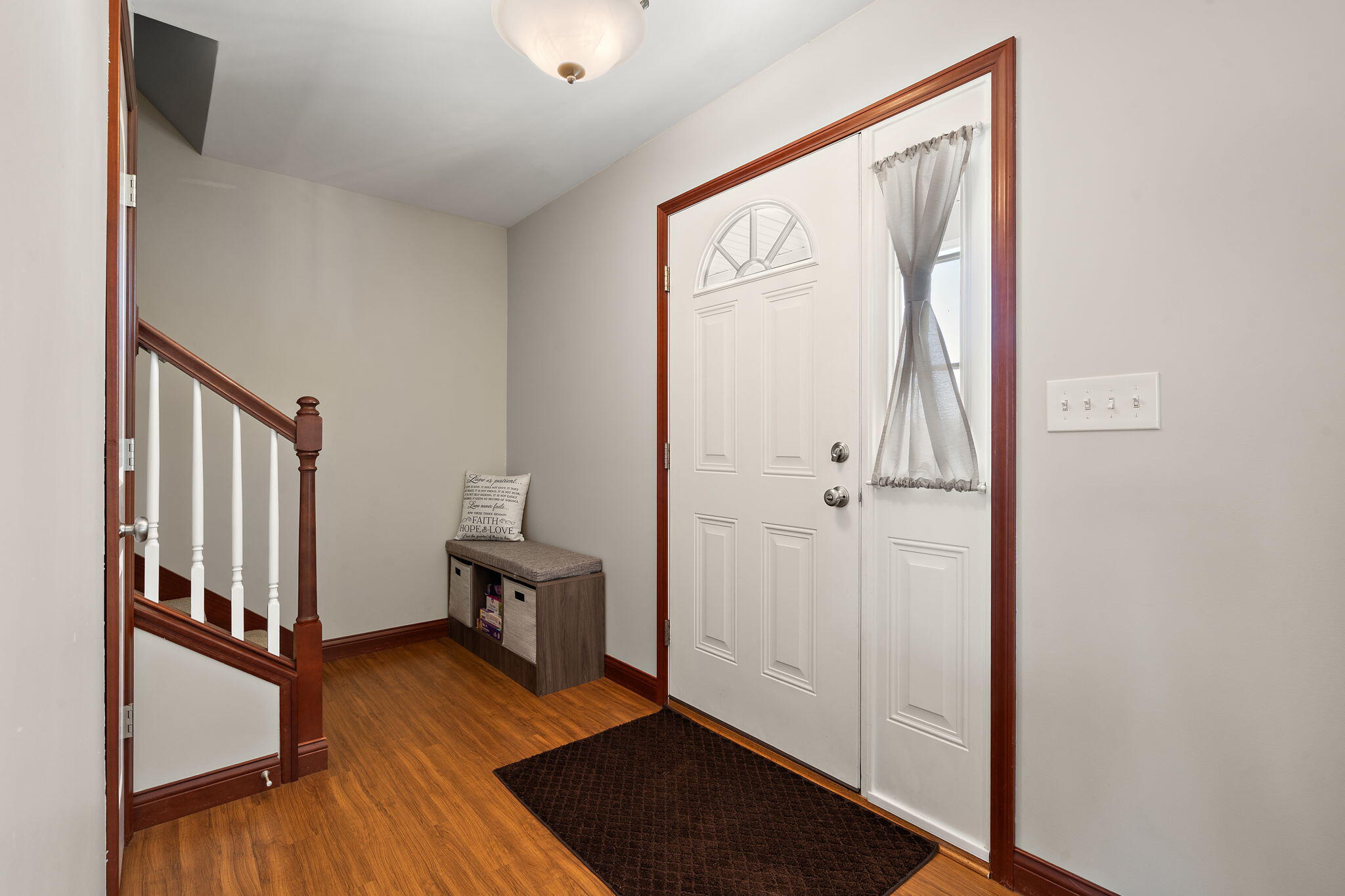 1156 Donegal Lane Crown Point, IN 46307 - Photo 5 of 25 a view of a hallway with wooden floor and staircase