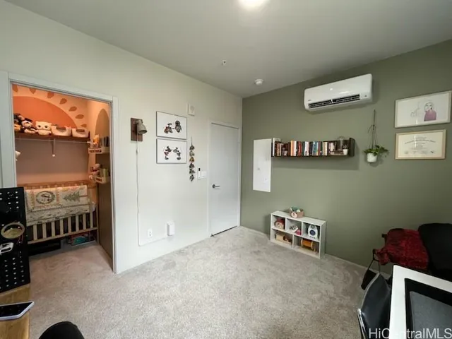 a view of room with hardwood floor and wardrobe