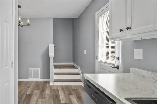 a view of a kitchen with furniture and window