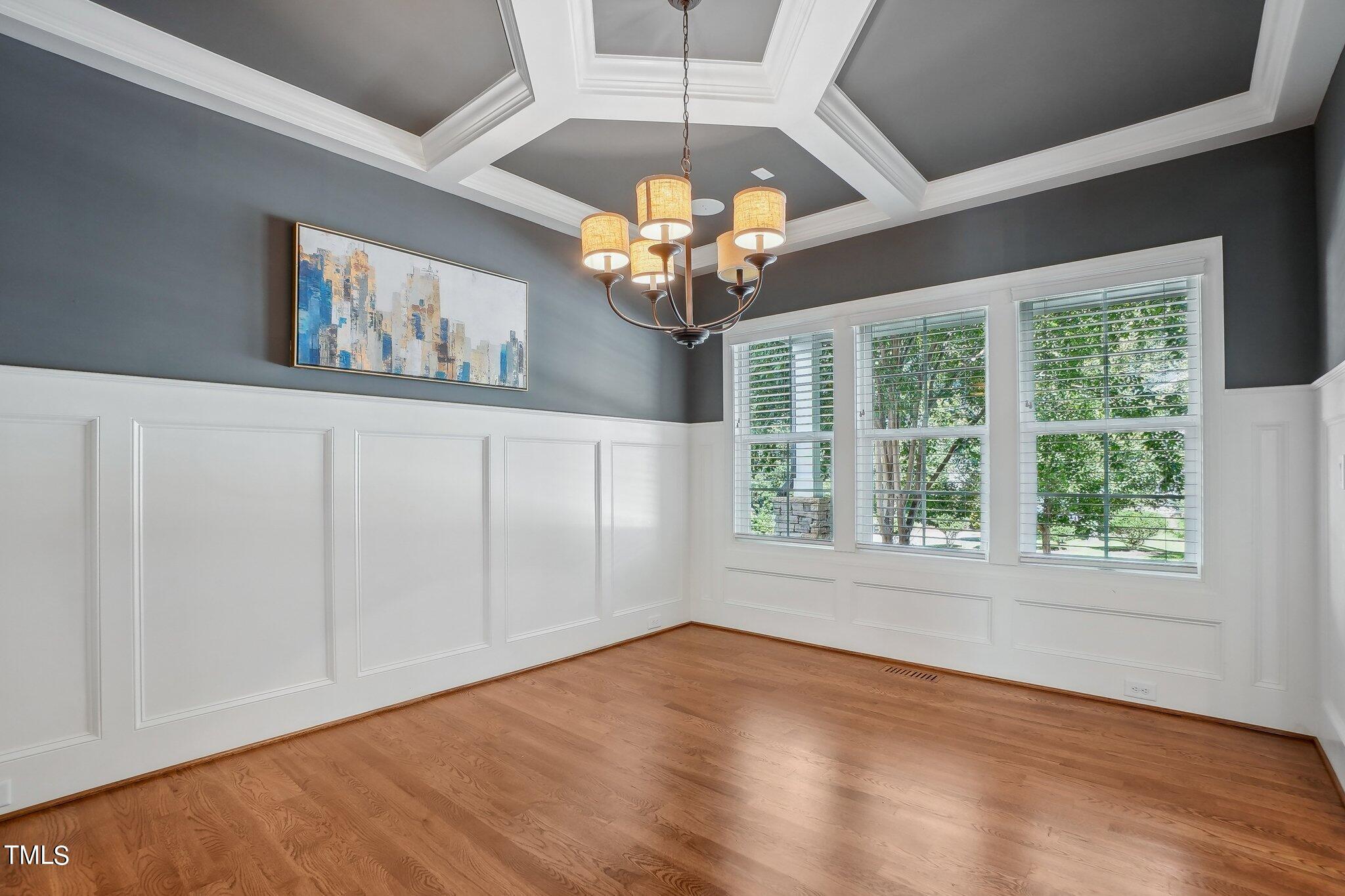 103 Pineland Circle Raleigh, NC 27606 - Photo 15 of 62 a view of an empty room with window and chandelier fan