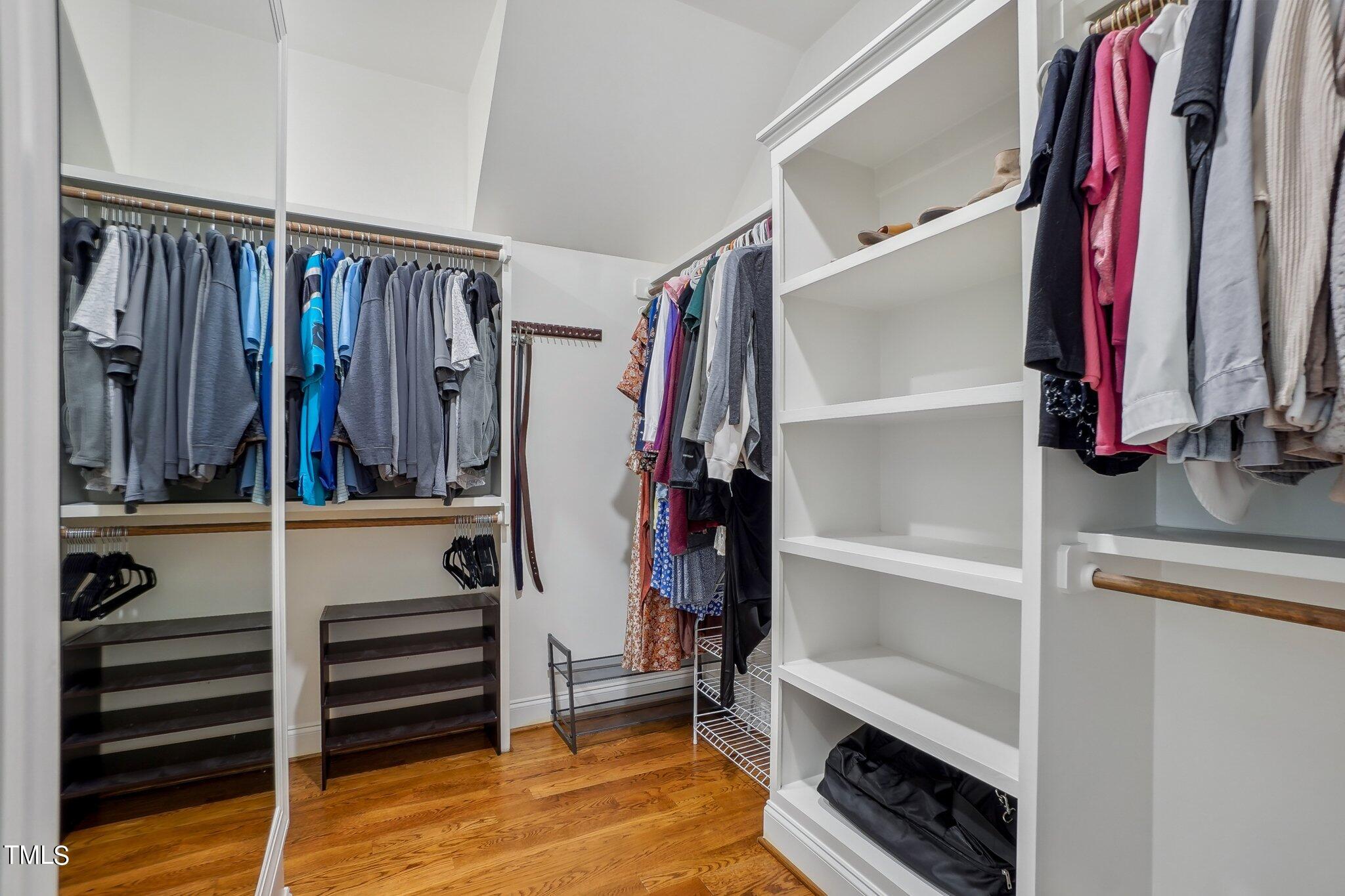 103 Pineland Circle Raleigh, NC 27606 - Photo 25 of 62 a view of walk in closet with clothes and shoes