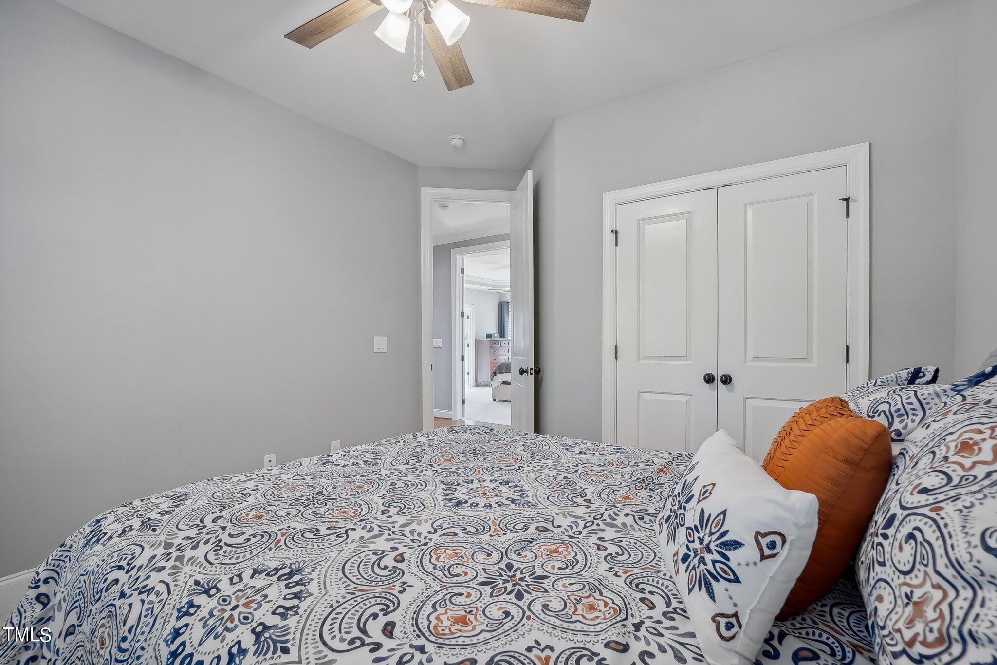 103 Pineland Circle Raleigh, NC 27606 - Photo 30 of 62 a bedroom with bed and wooden floor