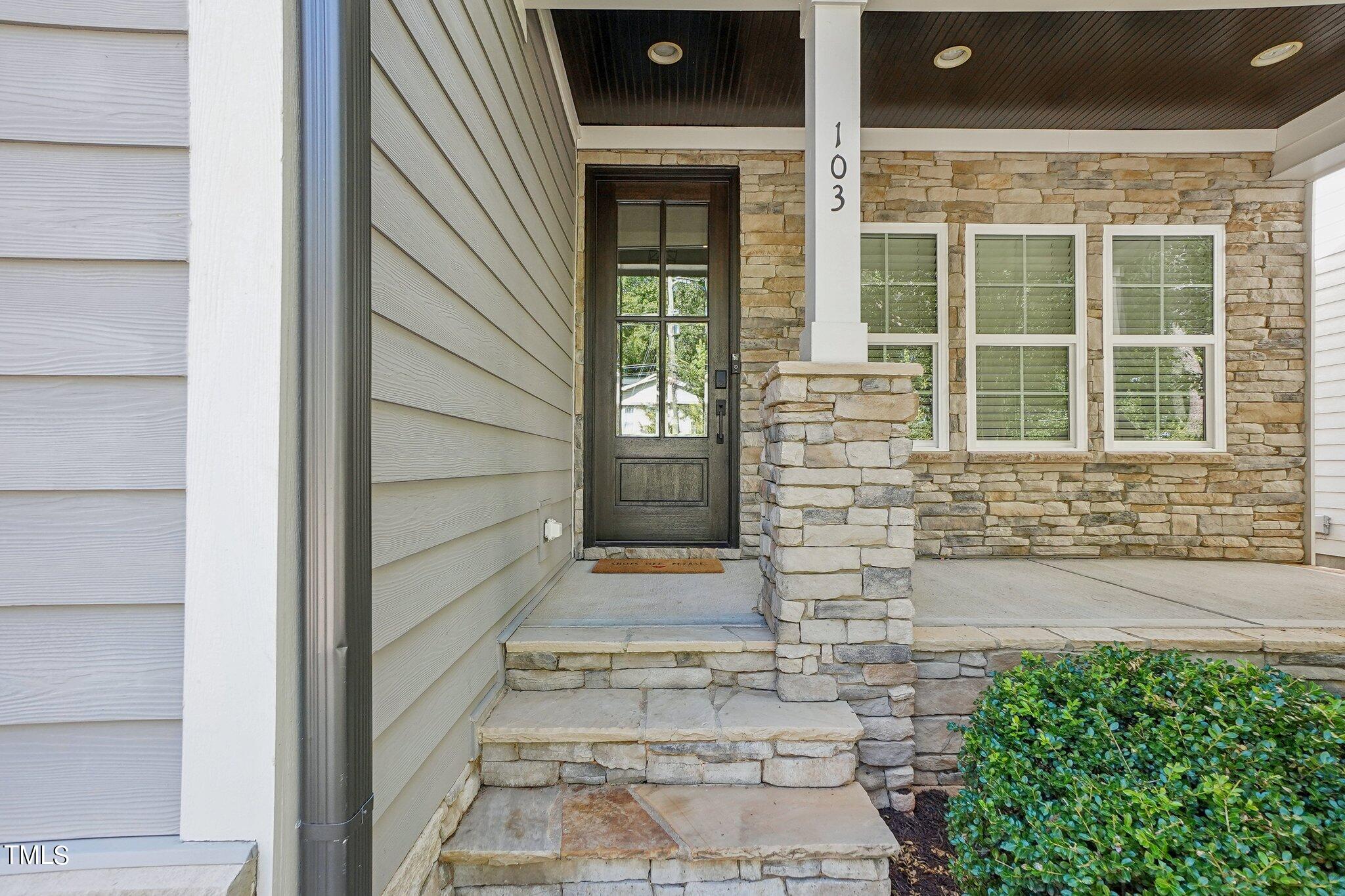 103 Pineland Circle Raleigh, NC 27606 - Photo 3 of 62 a view of entrance of the house with a large window