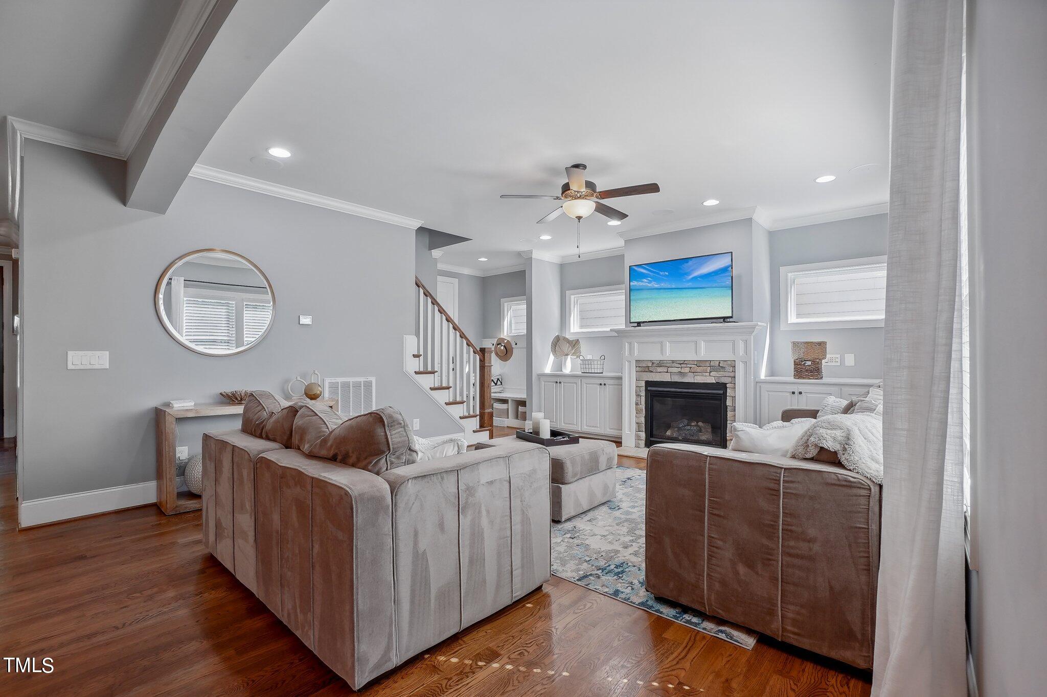 103 Pineland Circle Raleigh, NC 27606 - Photo 6 of 62 a living room with furniture and a fireplace