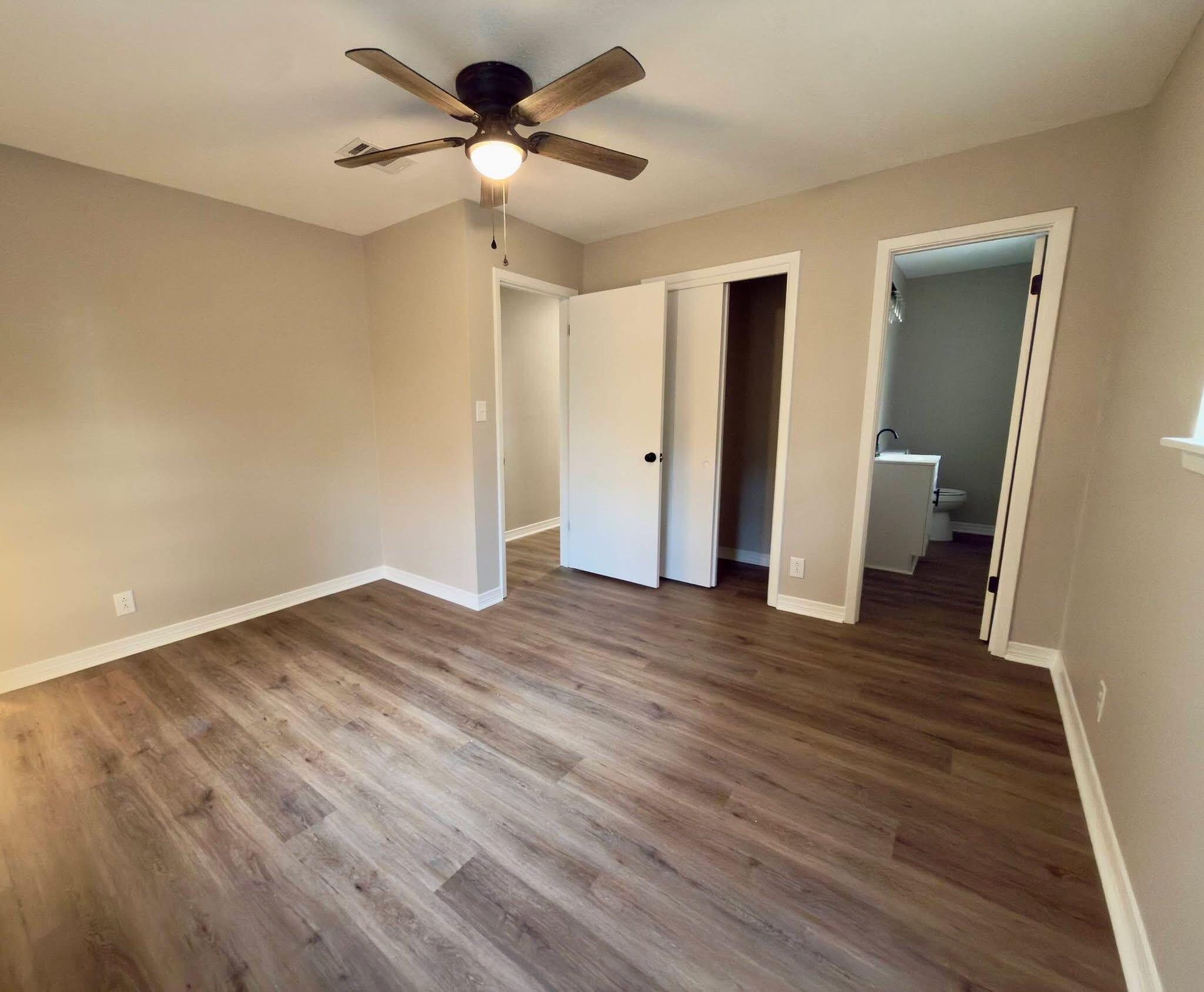 215 Jones Road Crestview, FL 32536 - Photo 4 of 9 a view of empty room with wooden floor