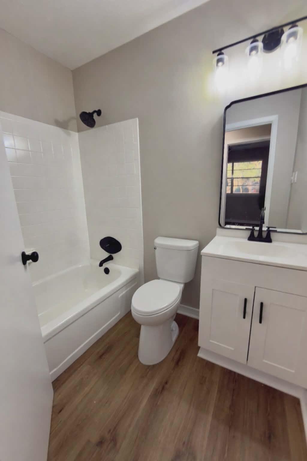 215 Jones Road Crestview, FL 32536 - Photo 5 of 9 a bathroom with a toilet a sink and a mirror