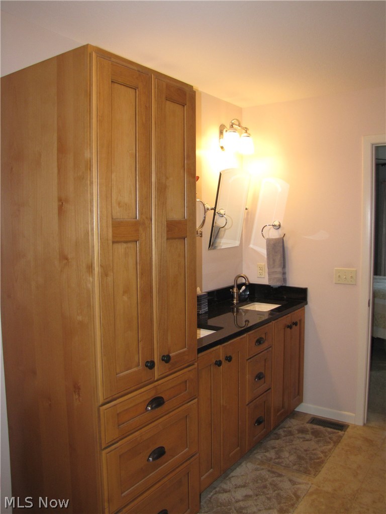 38836 Norwalk Road Litchfield, OH 44253 - Photo 13 of 27 Ample storage in the for towels toiletries