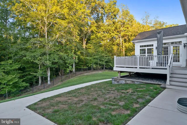 a living room with furniture and a gym equipment