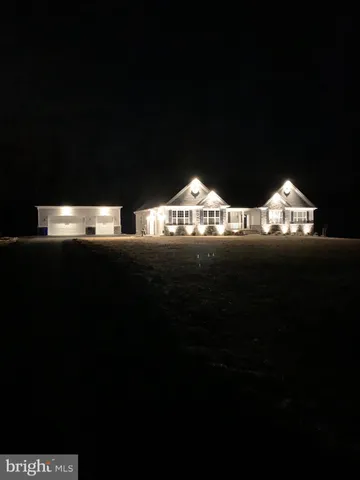 a living room with furniture and a ceiling fan