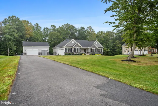 a bed room with a bed and a chandelier