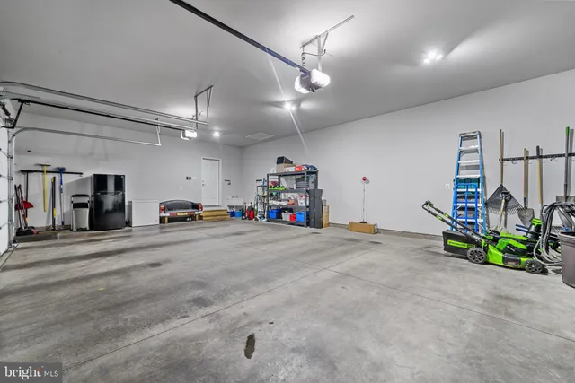 a kitchen with granite countertop a sink and cabinets