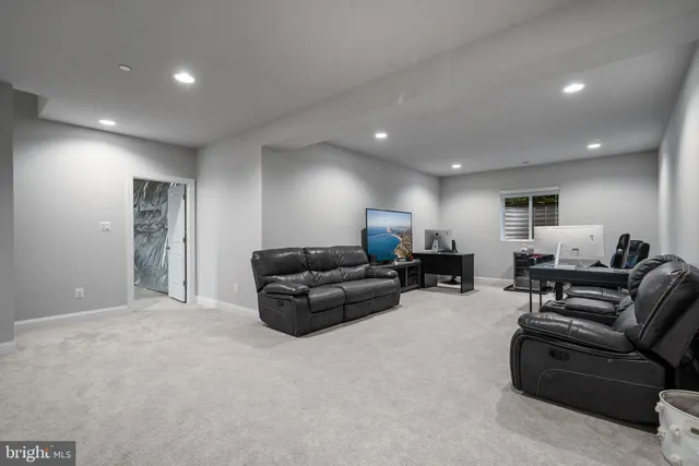 a spacious bedroom with a bed and a chandelier