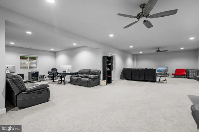 a spacious bedroom with a bed and a large mirror