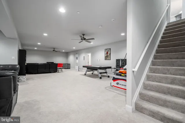 a spacious bedroom with a large bed and a dresser