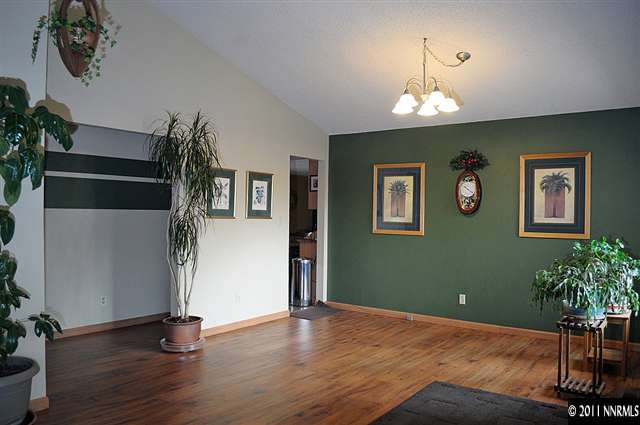 3485 Gulling Road Reno, NV 89503 - Photo 2 of 8 a view of a livingroom with wooden floor and a ceiling fan