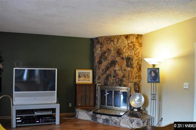 3485 Gulling Road Reno, NV 89503 - Photo 4 of 8 a living room with furniture and a flat screen tv