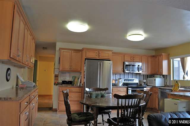 3485 Gulling Road Reno, NV 89503 - Photo 5 of 8 a kitchen with refrigerator and cabinets