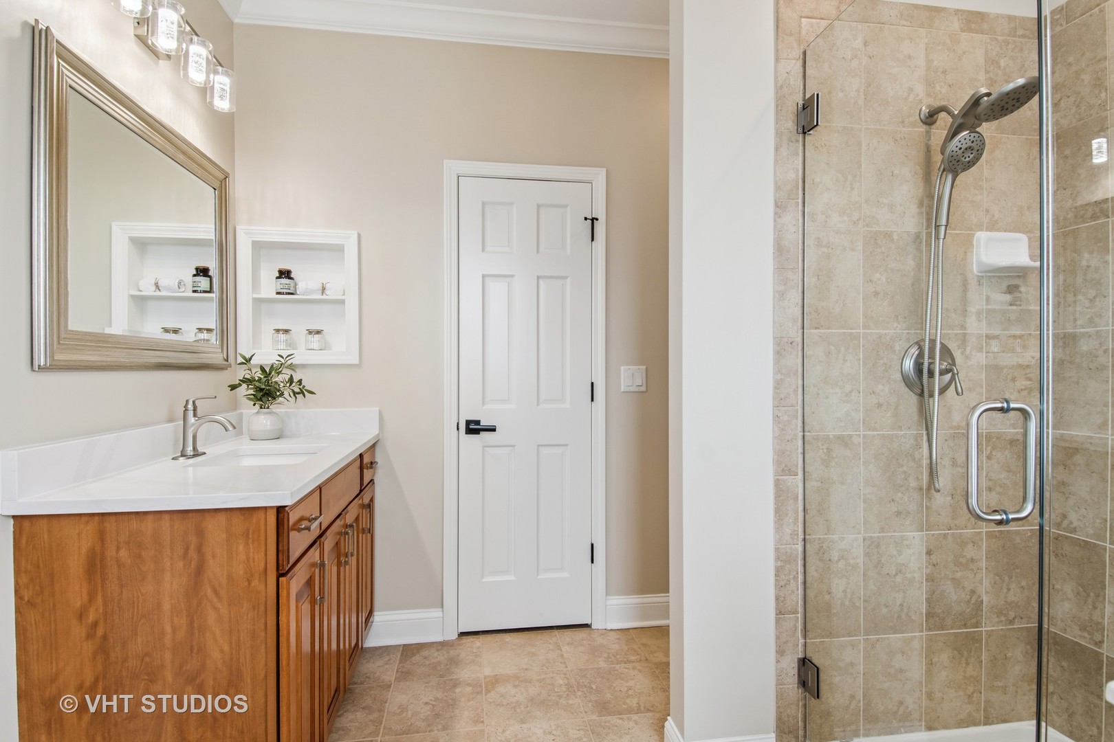 3607 Greystone Avenue Naperville, IL 60564 - Photo 22 of 59 a bathroom with a sink a mirror and shower