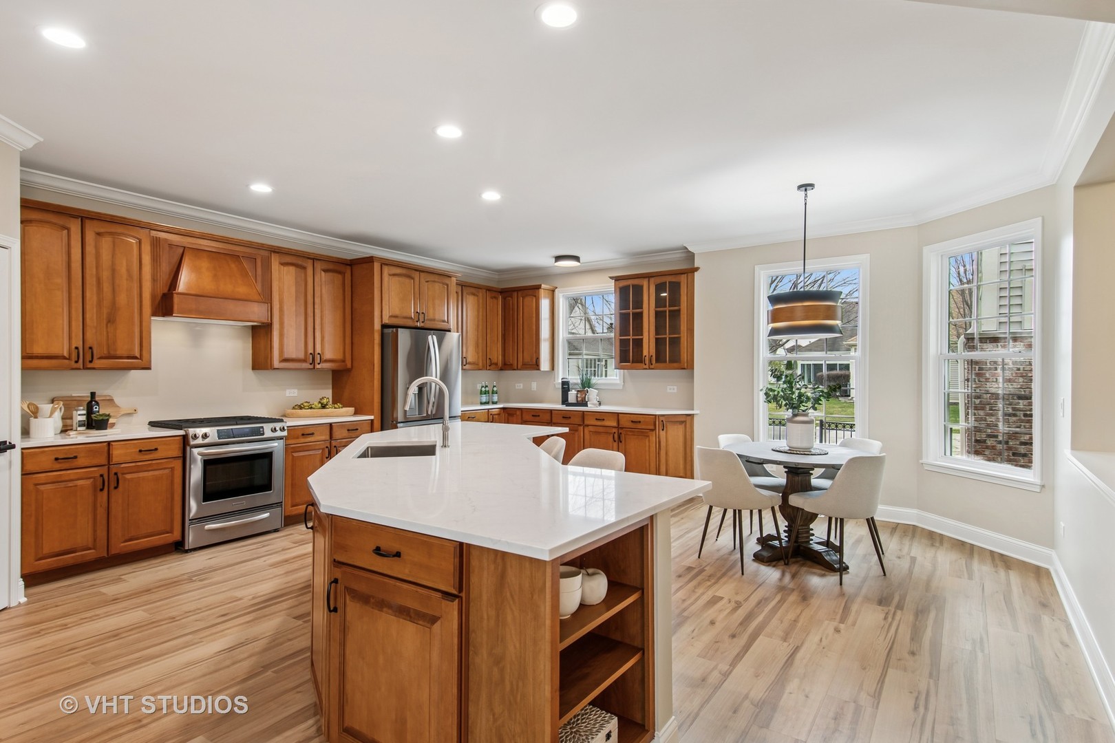 3607 Greystone Avenue Naperville, IL 60564 - Photo 6 of 59 a large kitchen with kitchen island a large island in it