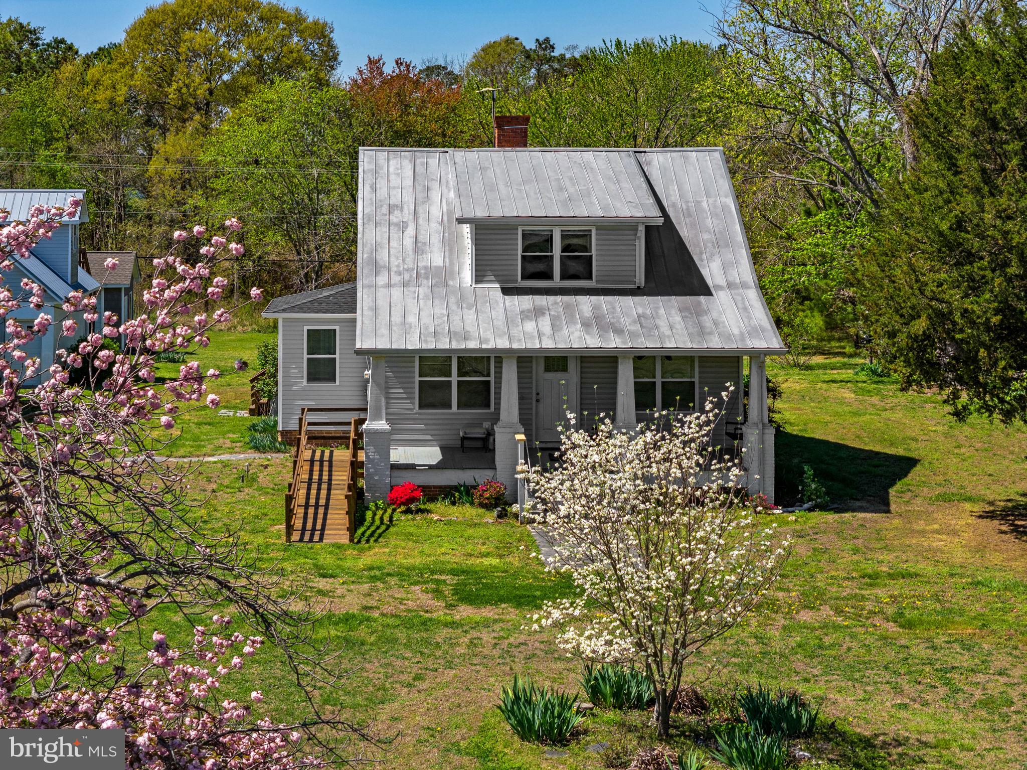 4809 Coles Point Road Hague, VA 22469 - Photo 12 of 49 Charming home amidst blooming trees.