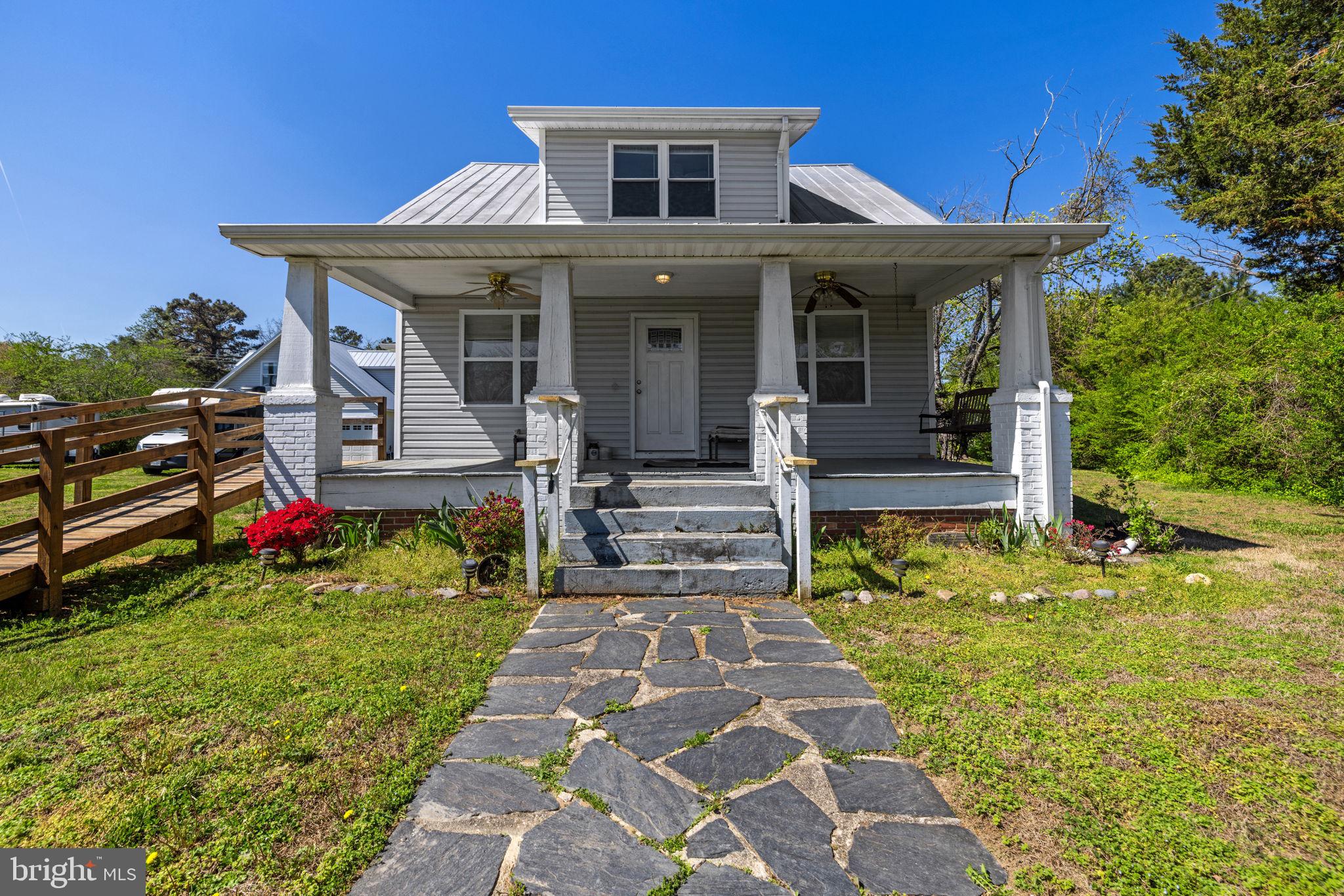 4809 Coles Point Road Hague, VA 22469 - Photo 15 of 49 Charming home with inviting porch.
