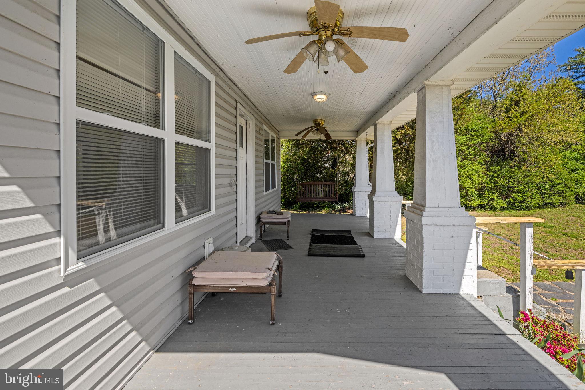 4809 Coles Point Road Hague, VA 22469 - Photo 16 of 49 Charming porch with serene views.