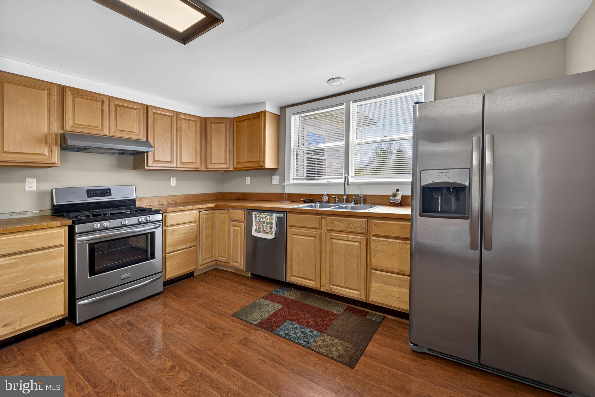 4809 Coles Point Road Hague, VA 22469 - Photo 25 of 49 Modern kitchen with warm wood tones.