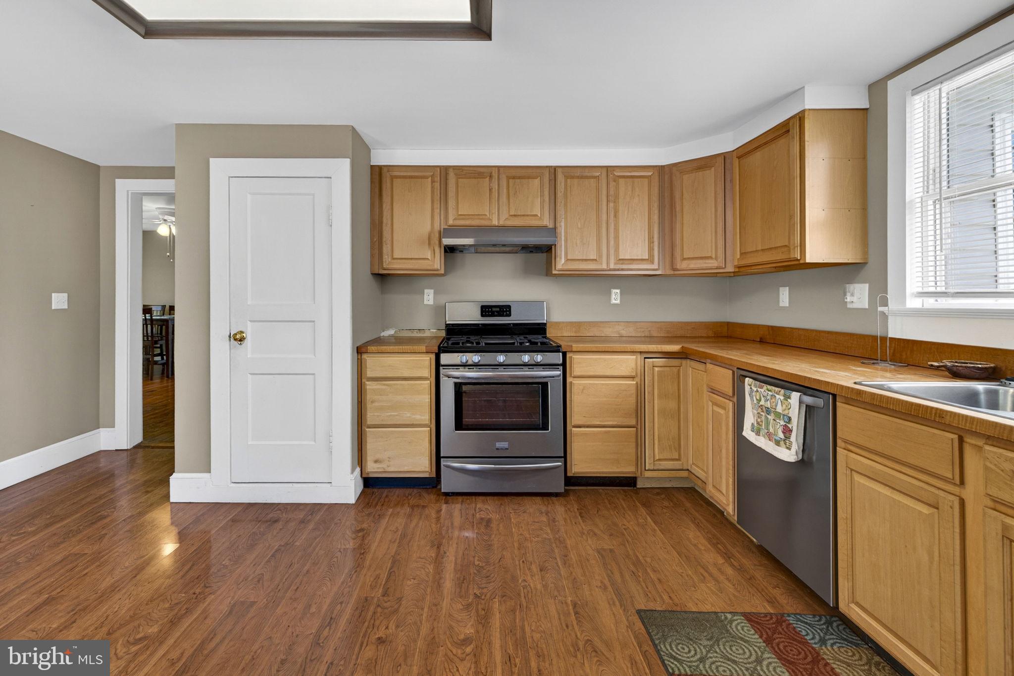 4809 Coles Point Road Hague, VA 22469 - Photo 26 of 49 Modern kitchen with warm wood tones.
