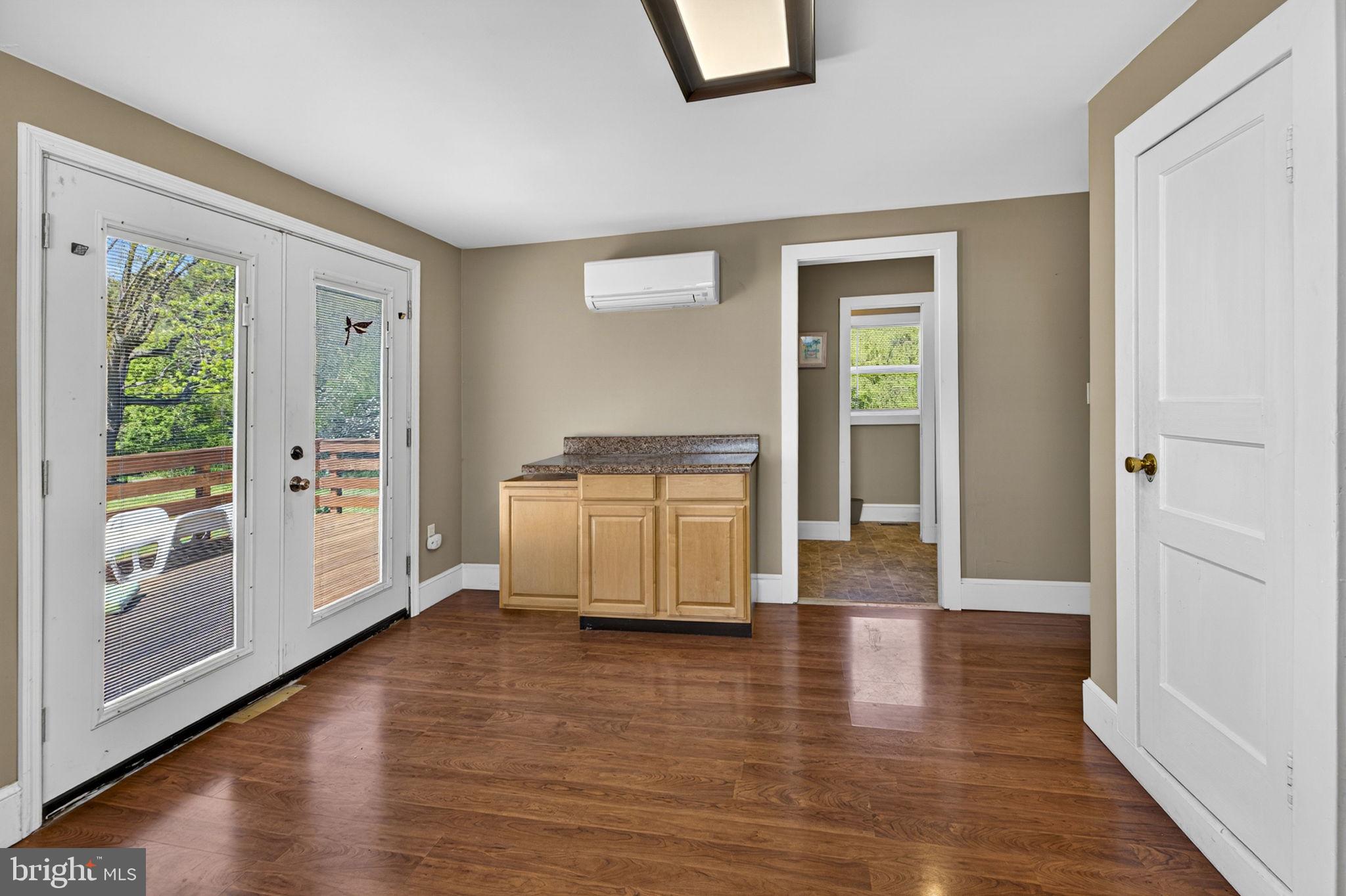4809 Coles Point Road Hague, VA 22469 - Photo 27 of 49 Bright and airy space with outdoor access.