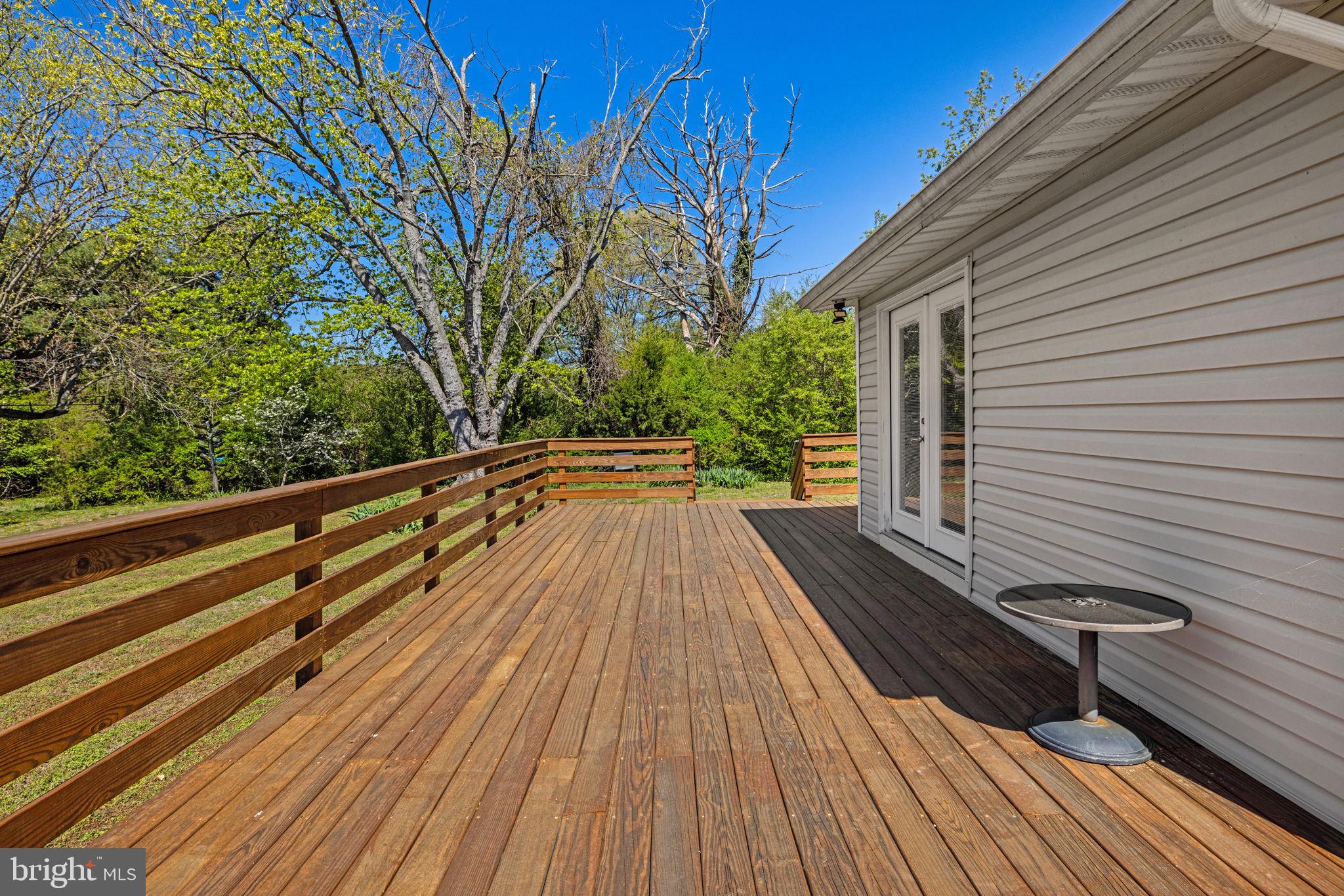 4809 Coles Point Road Hague, VA 22469 - Photo 36 of 49 Sunny deck with lush greenery views.