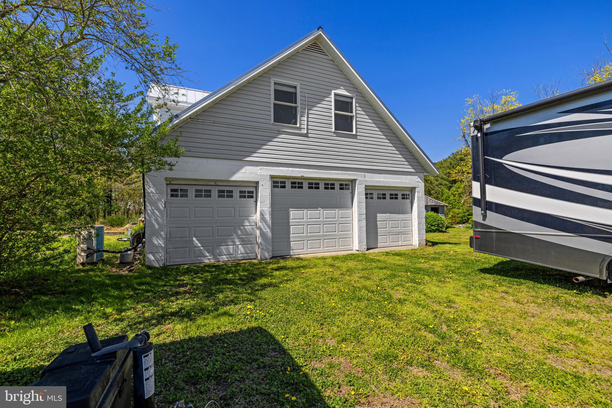 4809 Coles Point Road Hague, VA 22469 - Photo 43 of 49 Charming garage with serene surroundings.