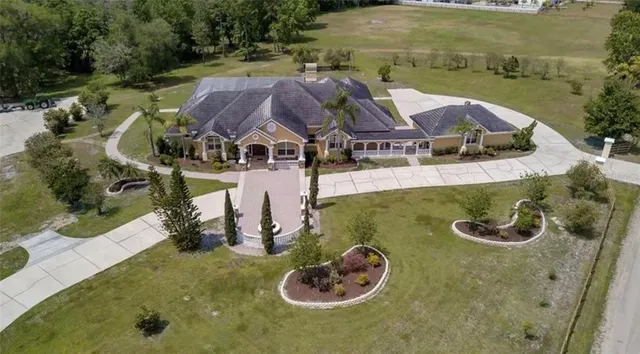 an aerial view of a house with outdoor space