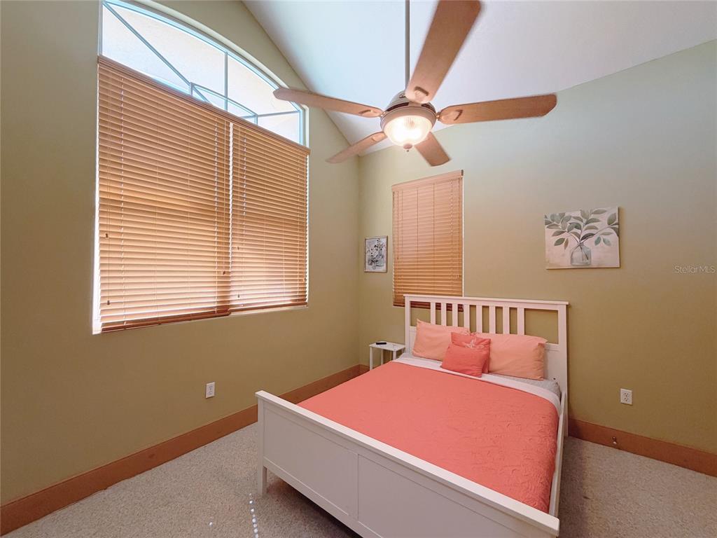 4421 Reaves Road Kissimmee, FL 34746 - Photo 12 of 100 a bedroom with a bed and a window