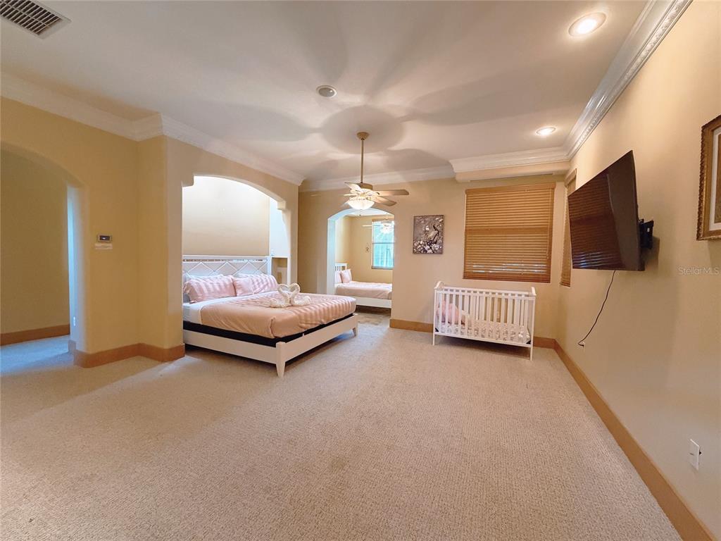 4421 Reaves Road Kissimmee, FL 34746 - Photo 15 of 100 a living room with furniture and a flat screen tv