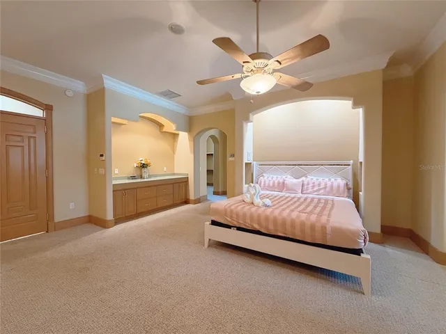 a spacious bathroom with a double vanity sink and a mirror