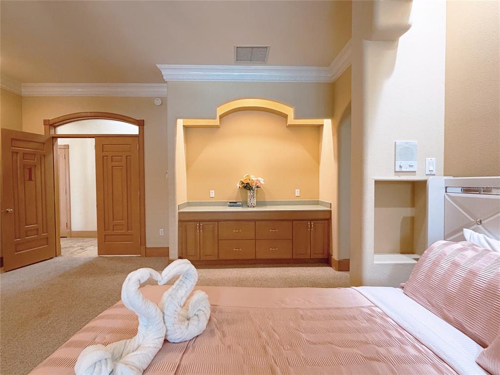 4421 Reaves Road Kissimmee, FL 34746 - Photo 18 of 100 a bedroom with a bed and a dresser