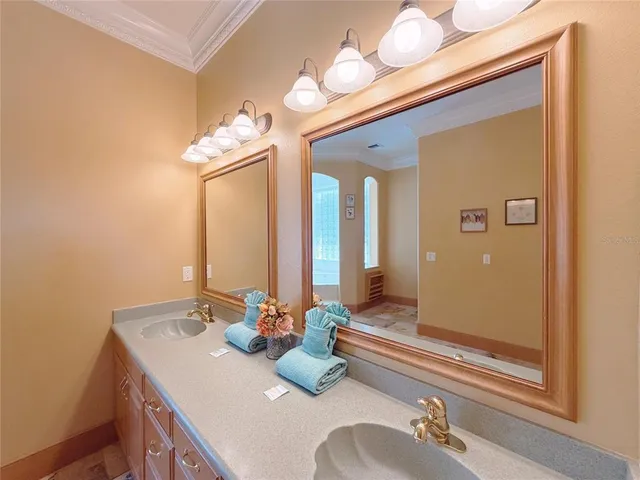 a kitchen with stainless steel appliances kitchen island granite countertop a sink dishwasher stove and cabinets